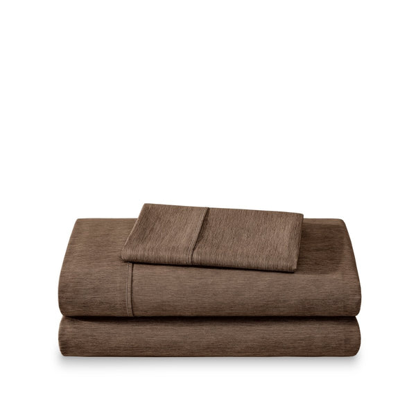 Set of bed sheets folded on a white background