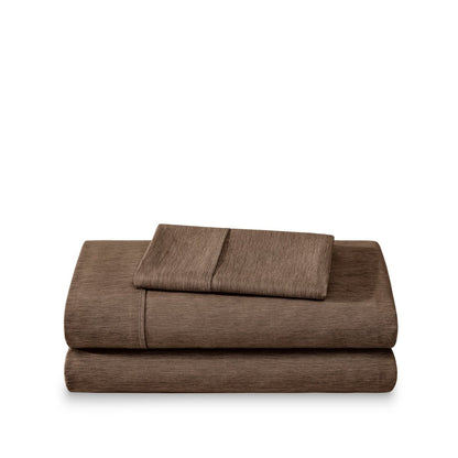Set of bed sheets folded on a white background