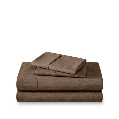 Set of bed sheets folded on a white background