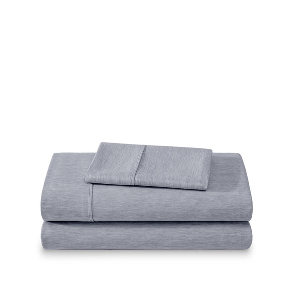 Set of bed sheets folded on a white background
