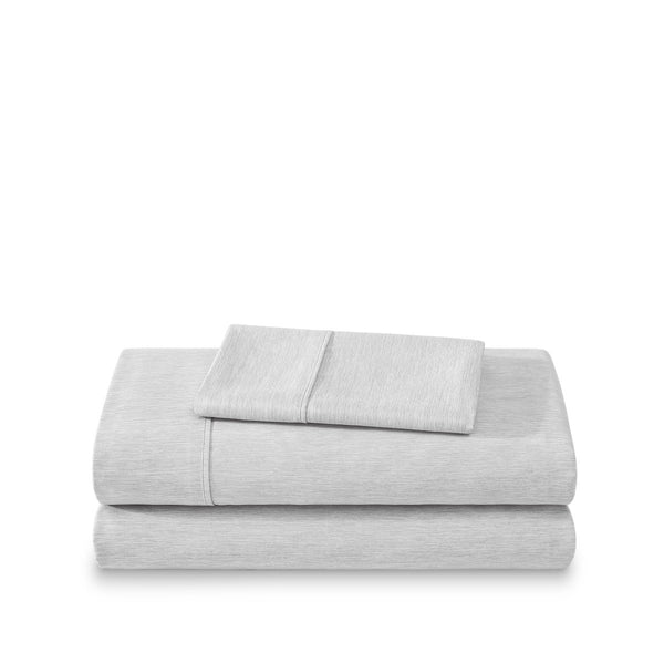 Set of bed sheets folded on a white background
