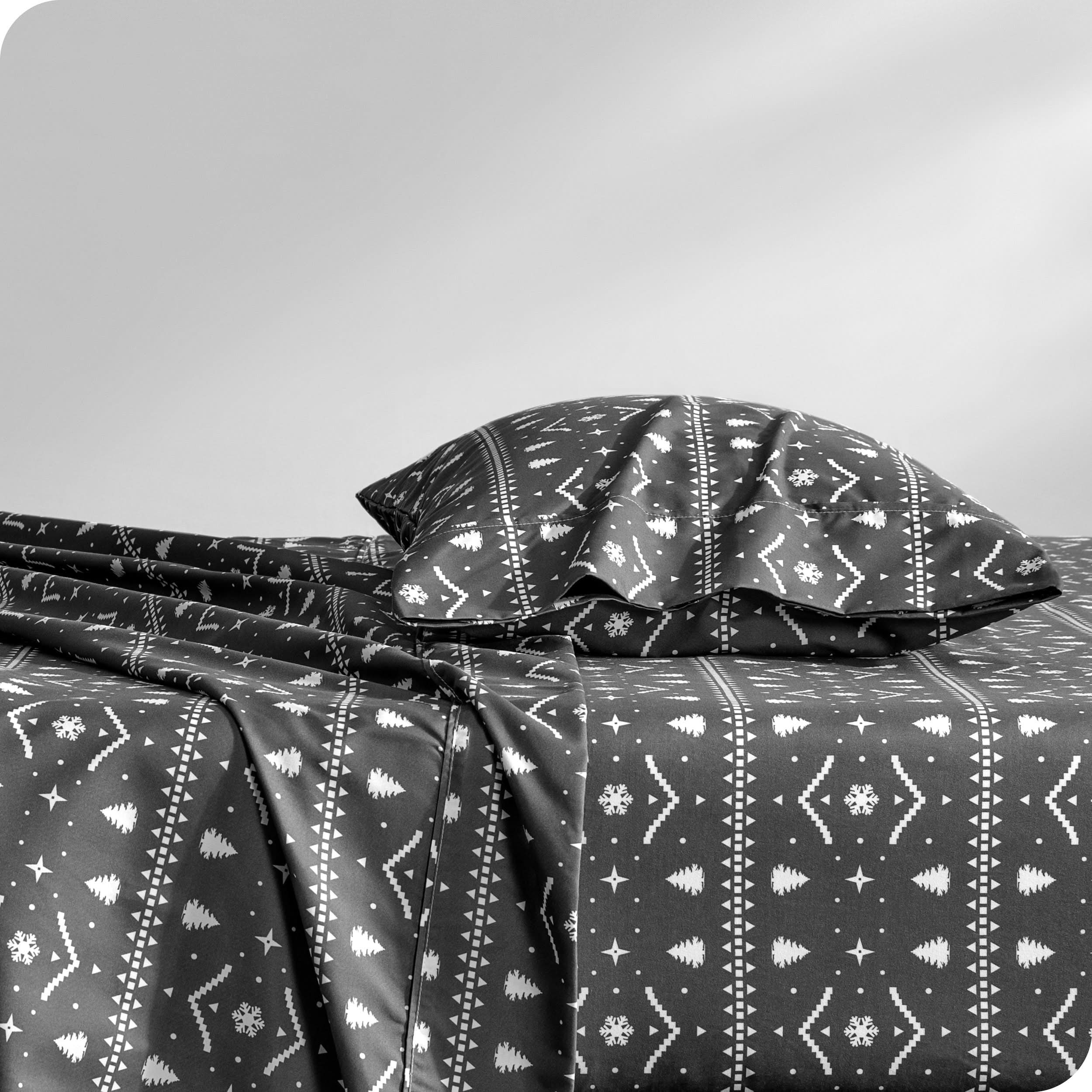 A sideview of a bed with a pillow in our microfiber sheet sets with a print/pattern.