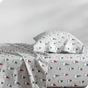 A sideview of a bed with a pillow in our microfiber sheet sets with a print/pattern.