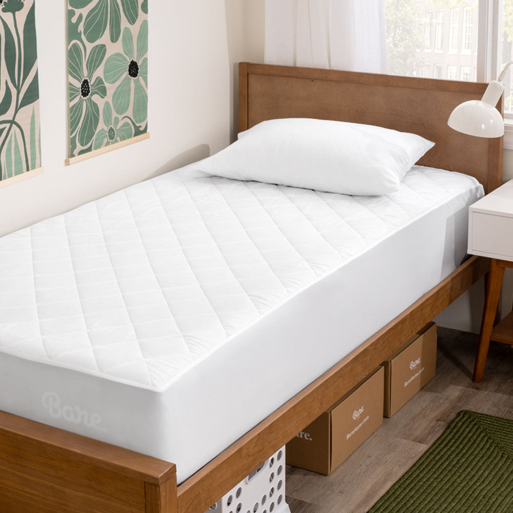Mattress Pad on a twin xl bed in a dorm room