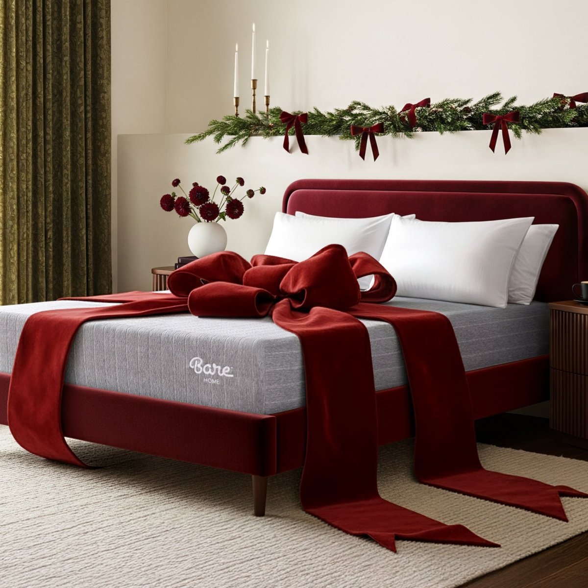 Decorative bed with red ribbon and 'Bare' mattress in a festive bedroom setting.
