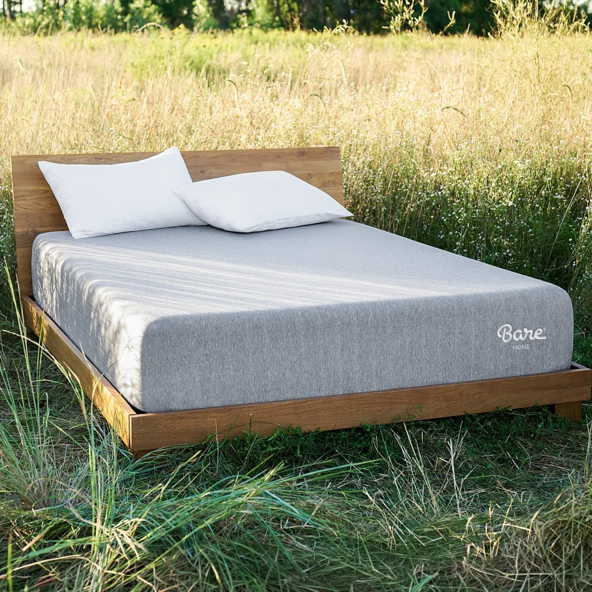 Bed with Bare Home mattress outside in a field