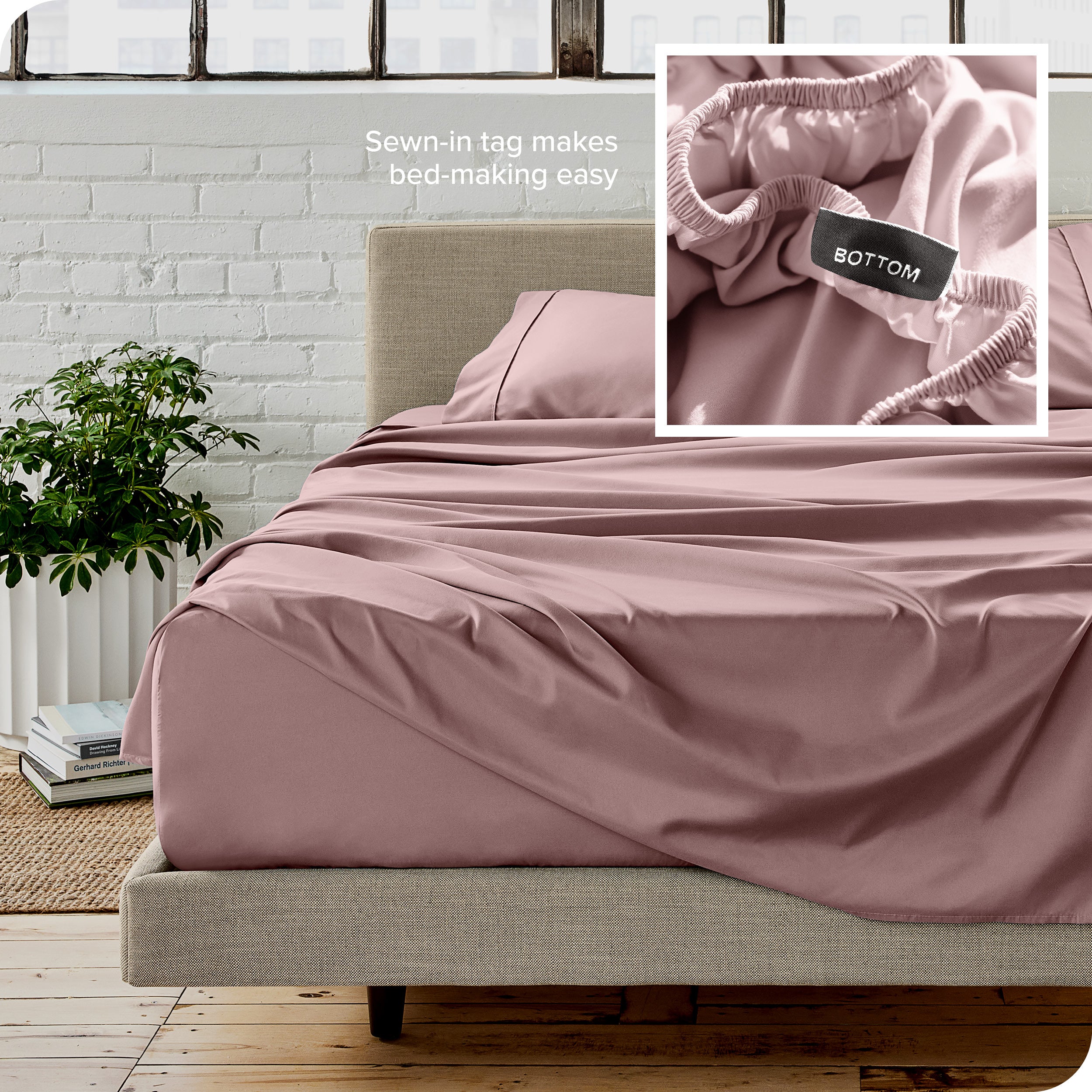 Close up of sewn in tag and matching sheets on a bed