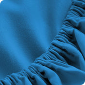 Close up of a fitted sheet with all around elastic