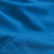 A close-up of microfiber fabric with soft folds and a visible stitched seam.