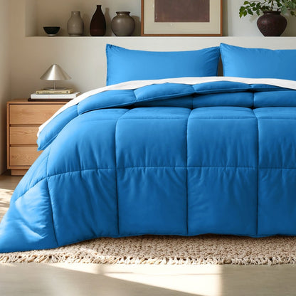 Comforter on a bed in a bedroom setting with a wooden nightstand and decorative items.