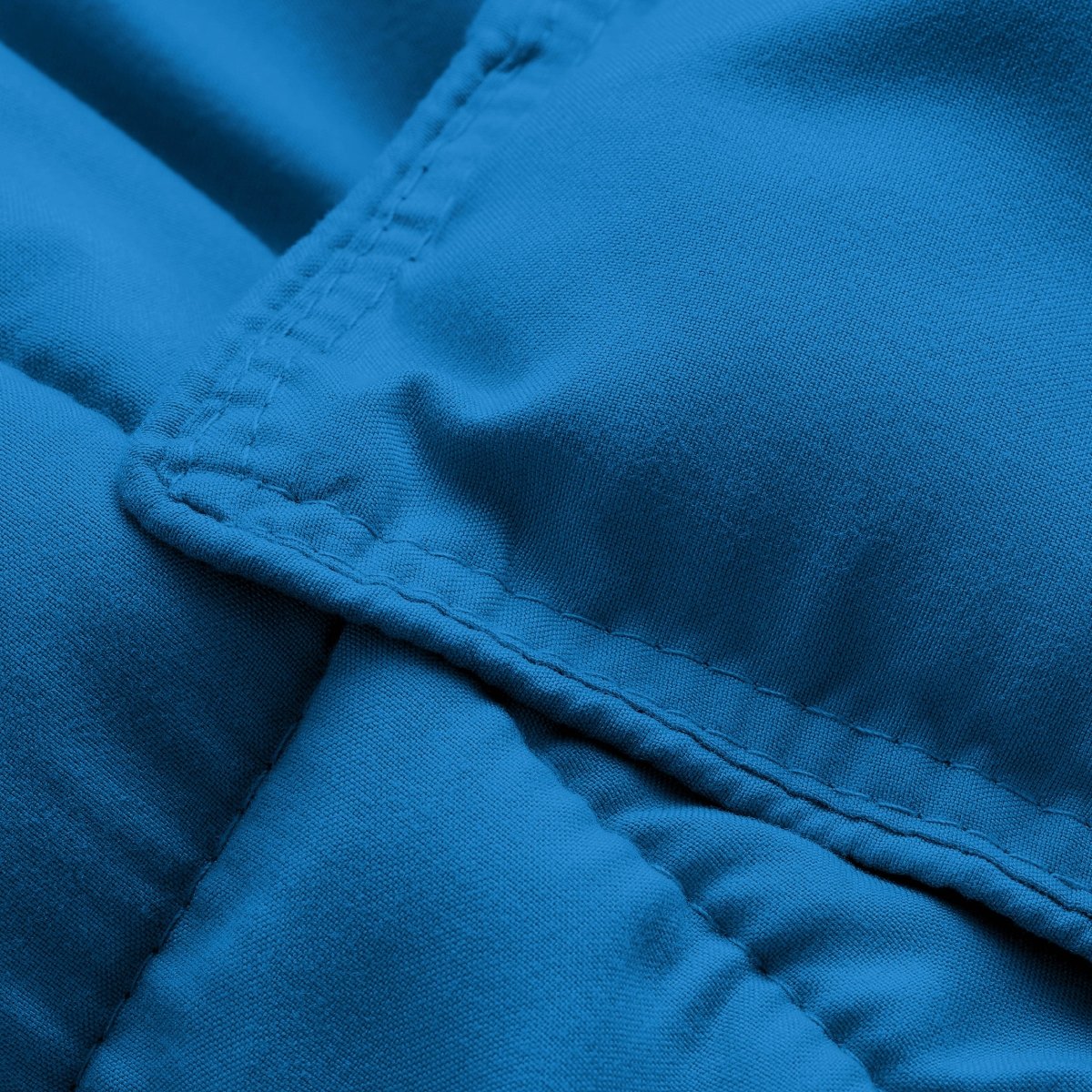 Close-up of comforter fabric with stitching detail