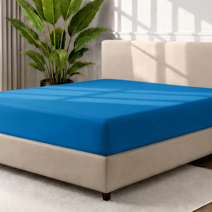Ultra soft fitted sheet on a mattress with the sun shining into the bedroom