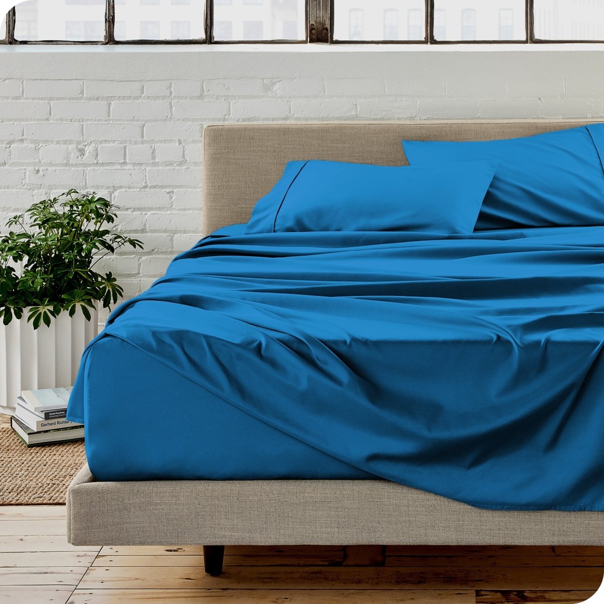 A modern bedroom with microfiber sheets on the mattress