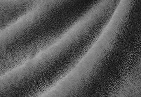 Closeup of dark gray Microplush fabric swatch