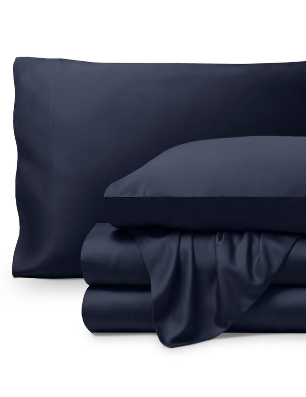 Bamboo pillowcases and sheets set on a white background