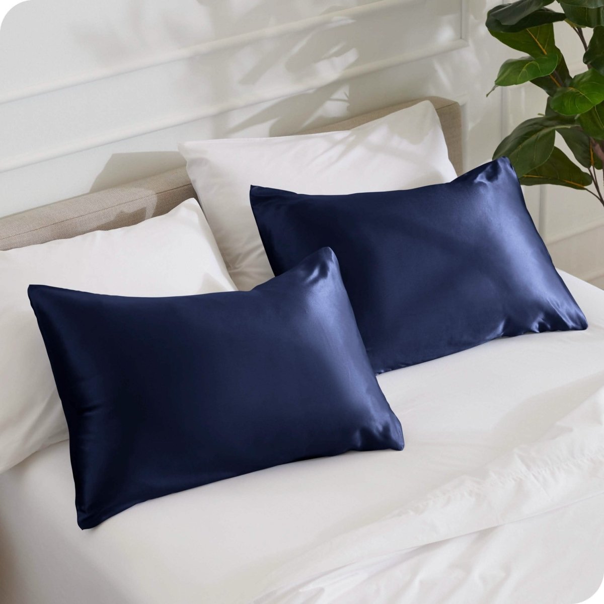 2 mulberry silk pillowcases on pillows set on a bed