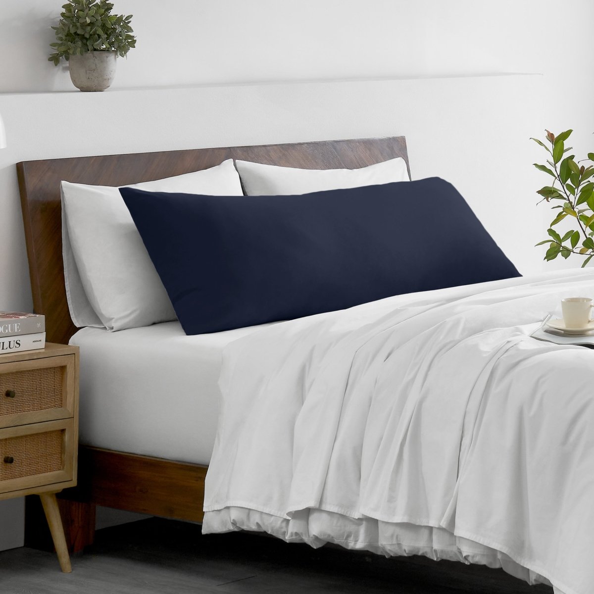 Bed with microfiber bedding and wooden headboard in a bedroom setting