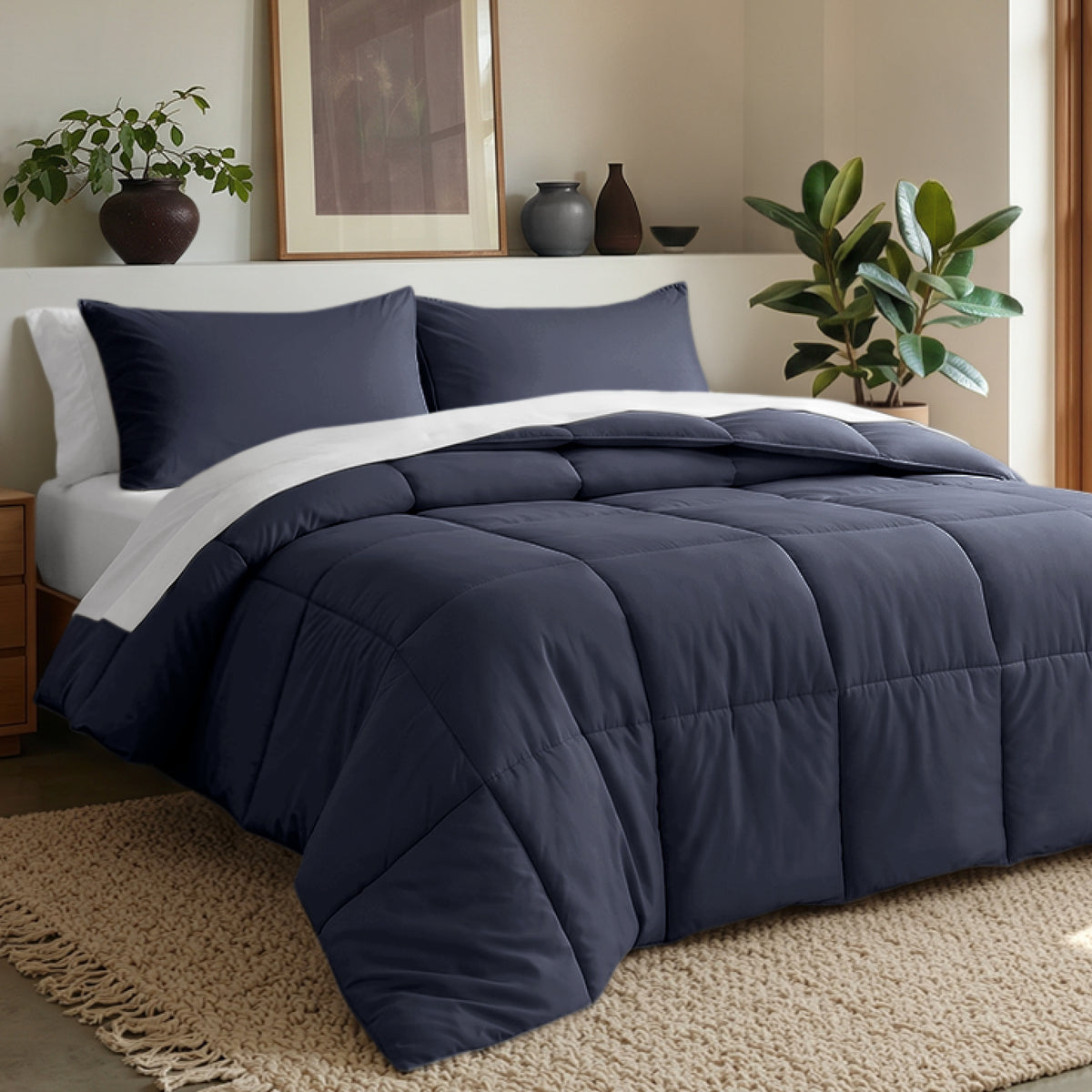 Comforter set on a bed in a bedroom with plants and decor.