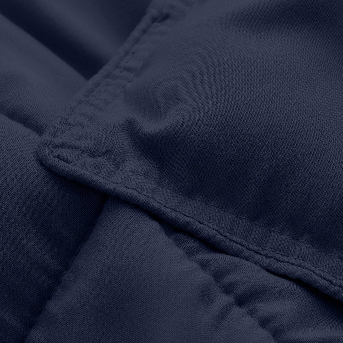 Close-up of comforter fabric with stitching detail