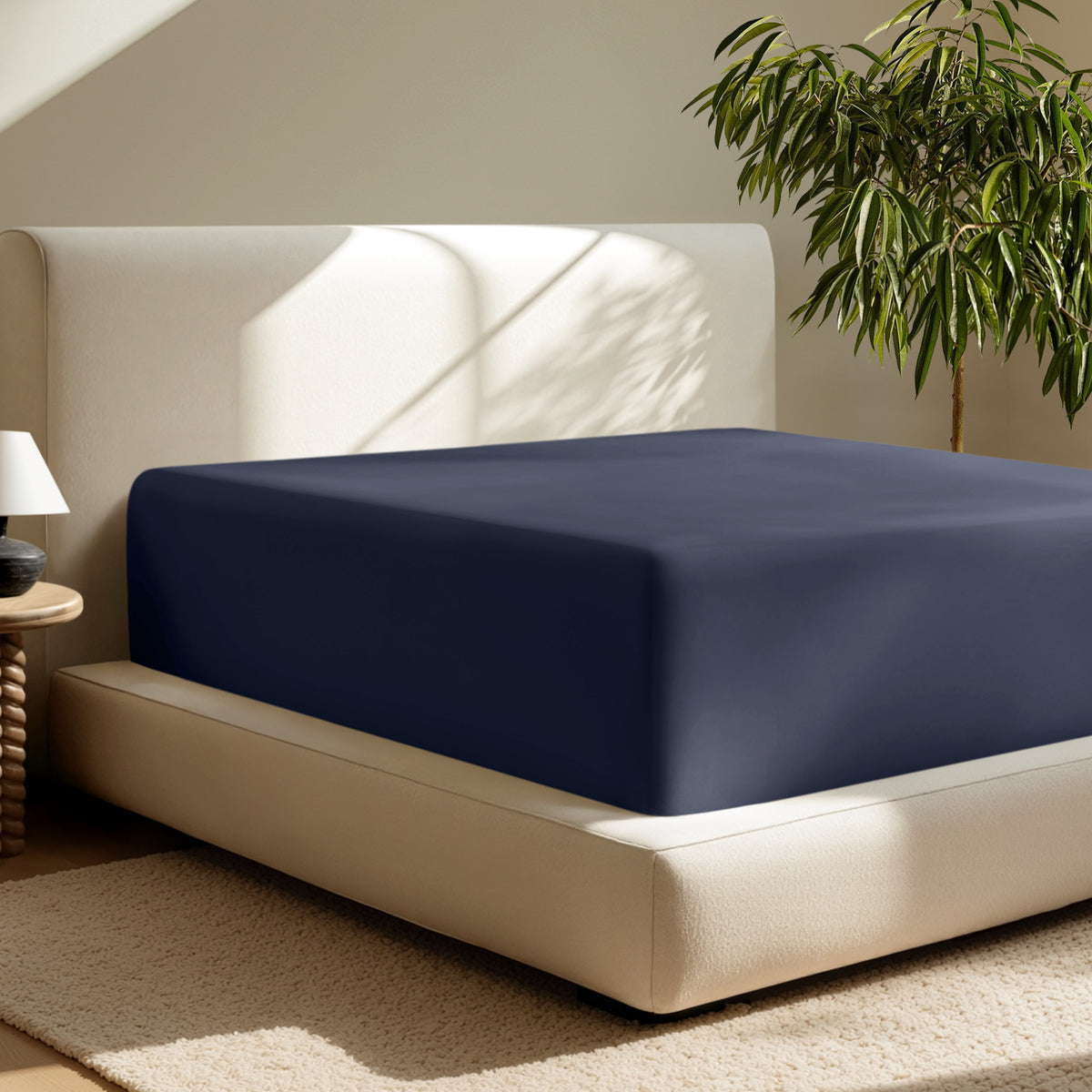A deep pocket fitted sheet on a mattress