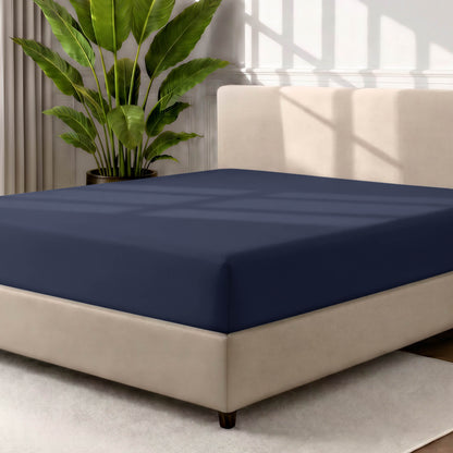 Ultra soft fitted sheet on a mattress with the sun shining into the bedroom