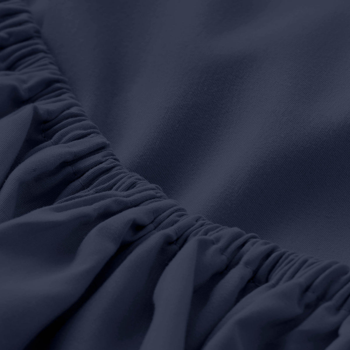 Close-up of fitted sheet with all around elastic