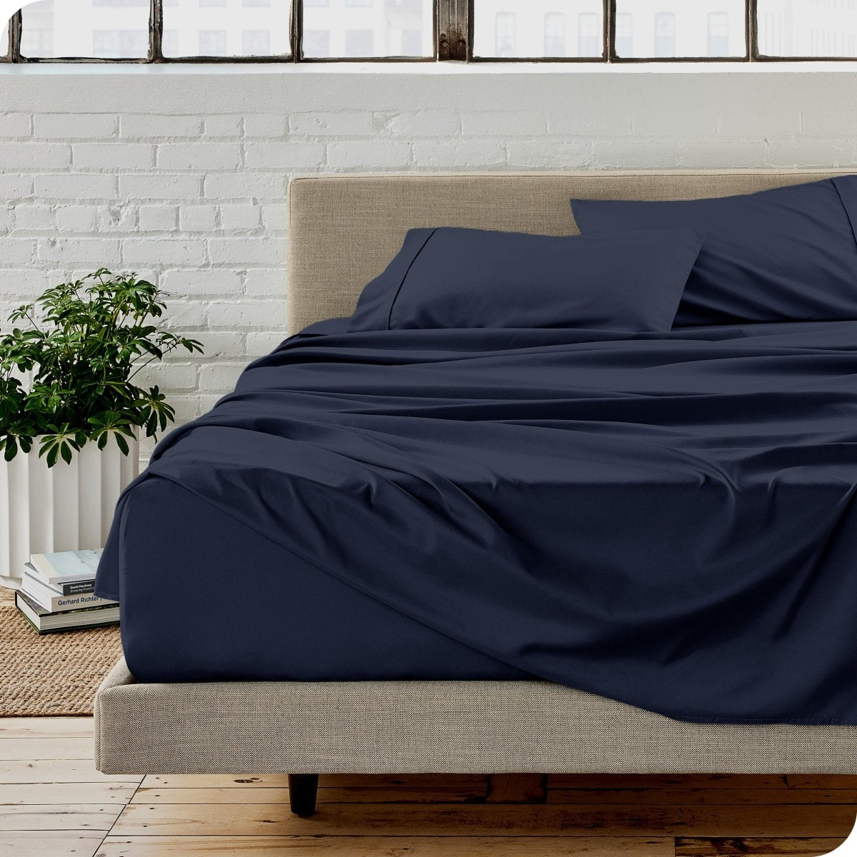 A modern bedroom with microfiber sheets on the mattress