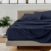 A modern bedroom with microfiber sheets on the mattress