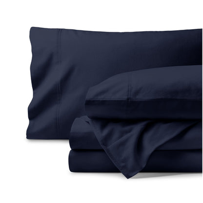 Organic flannel bed sheets and pillowcase set on a white background