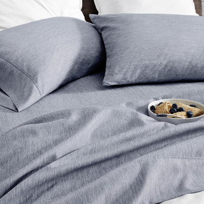 Ultra soft sheet set with a bowl of food on a bed