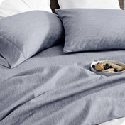 A side view of a bed with microfiber sheets