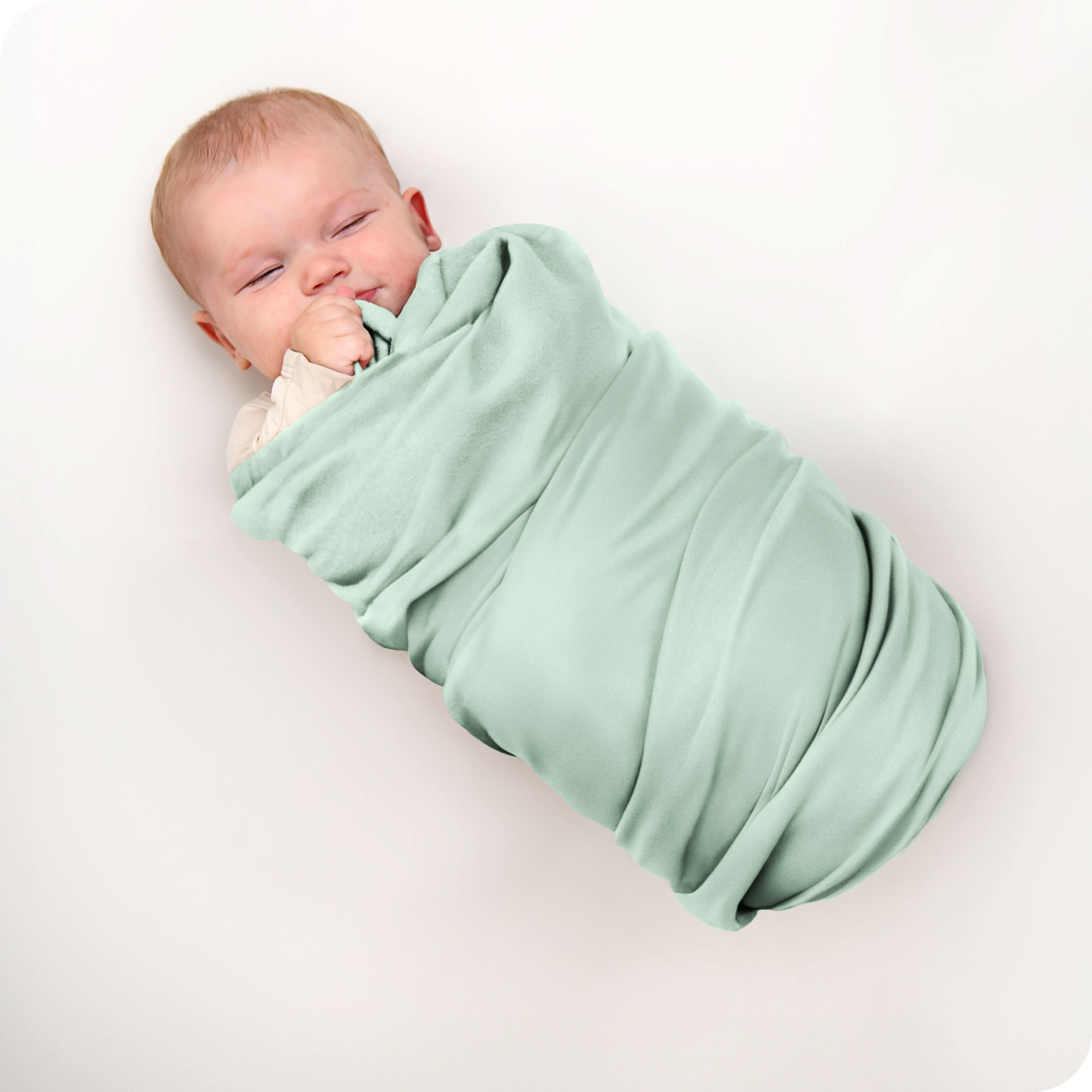 A baby swaddled in a receiving blanket