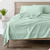 A modern bed with a flannel sheet set on