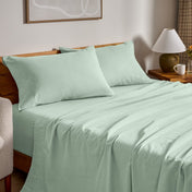 Flannel bed sheets and pillowcases on a bed in a bedroom setting.