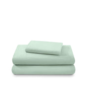 Cotton flannel sheet set folded and stacked on a white background