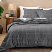 Modern plaid comforter set on a bed