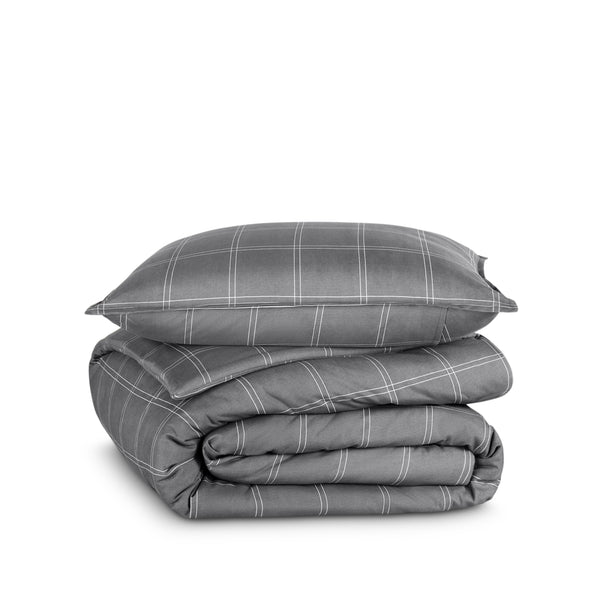 A printed comforter set folded and stacked