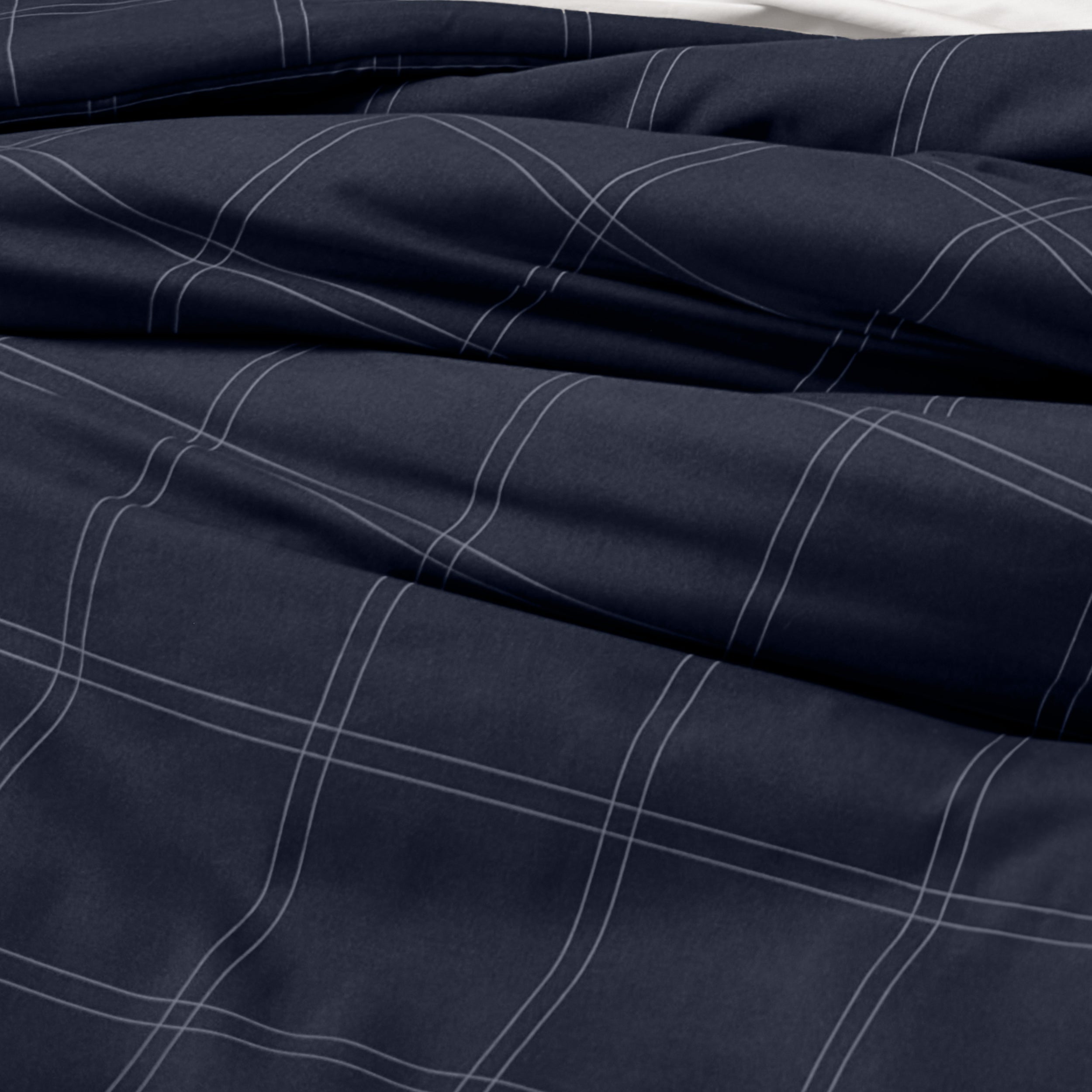 Close-up of comforter on a bed