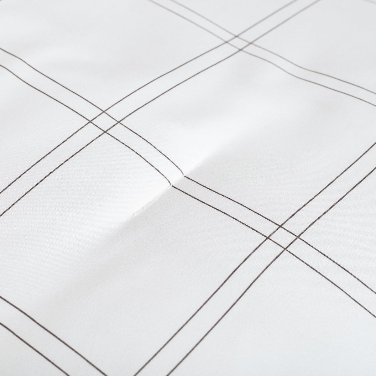 Close-up of comforter on a bed