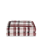 Stack of flannel sheets and pillowcases on a white background