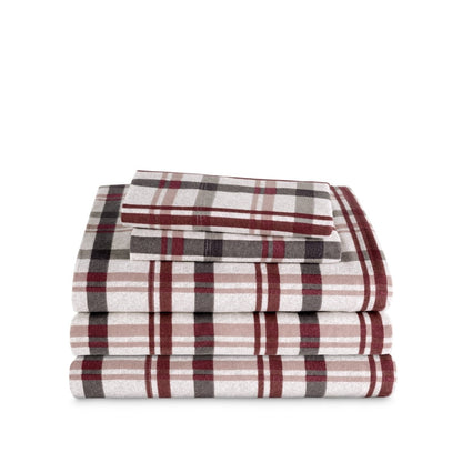 Stack of flannel sheets and pillowcases on a white background