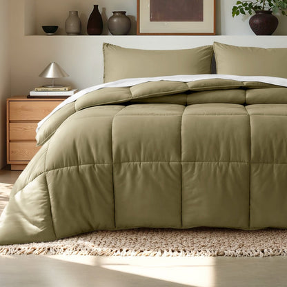 Comforter on a bed in a bedroom setting with a wooden nightstand and decorative items.
