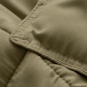 Close-up of comforter fabric with stitching detail