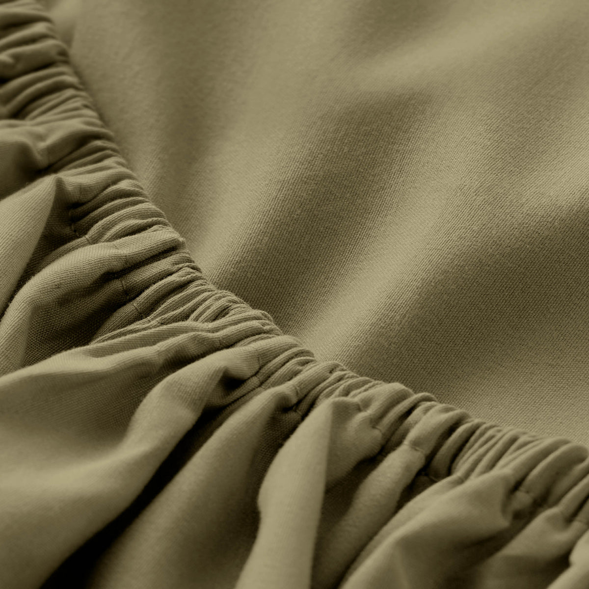 Ultra soft fitted sheet on a mattress with the sun shining into the bedroom