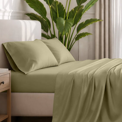 Ultra-soft sheets and pillowcases on a bed with a plant in the background
