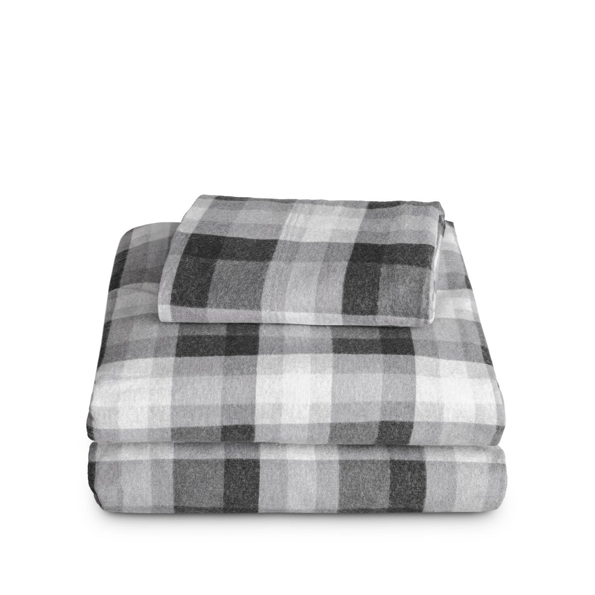 Stack of flannel sheets and pillowcases on a white background