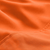 A close-up of microfiber fabric with soft folds and a visible stitched seam.
