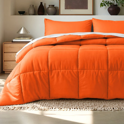 Comforter on a bed in a bedroom setting with a wooden nightstand and decorative items.
