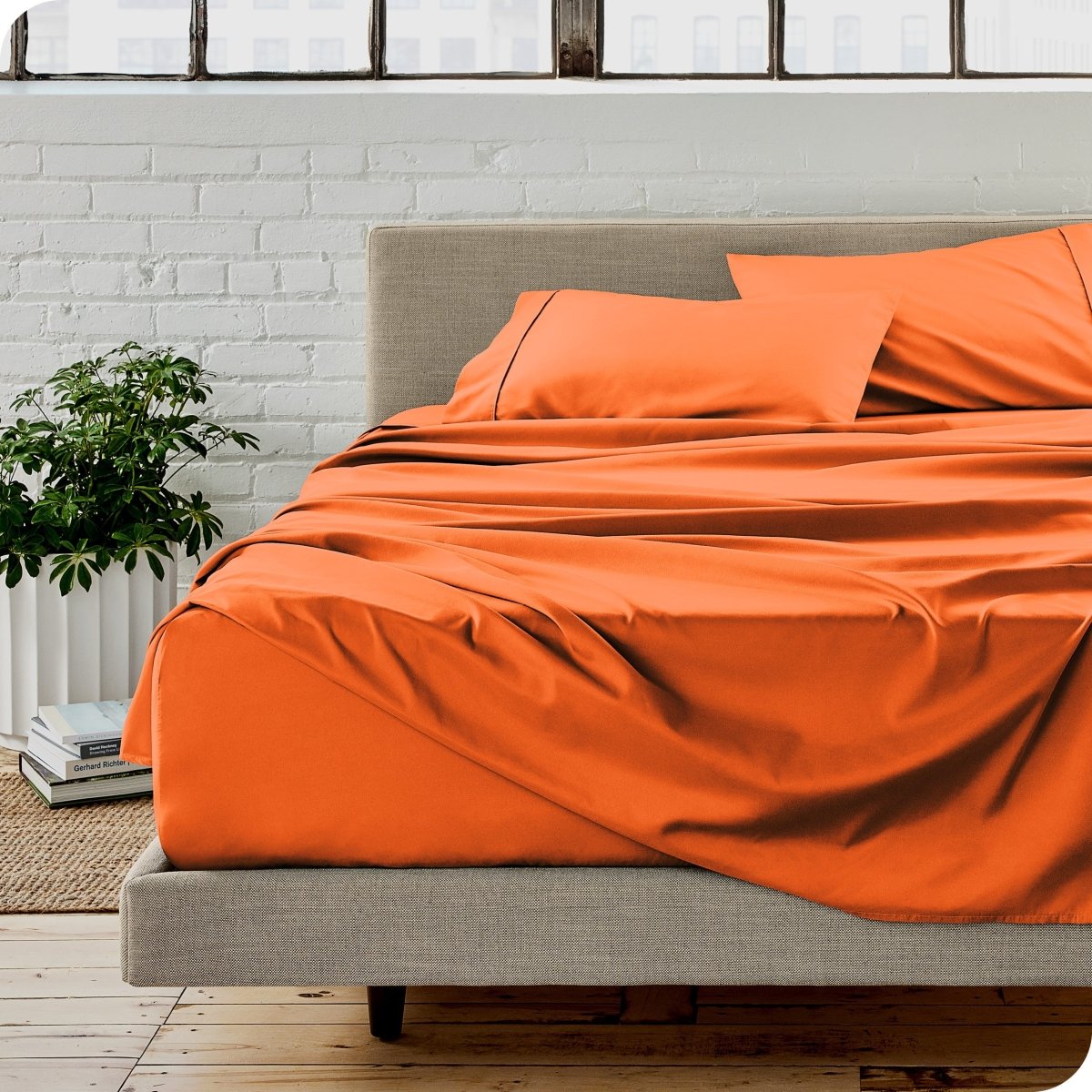 A modern bedroom with microfiber sheets on the mattress