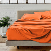 A modern bedroom with microfiber sheets on the mattress